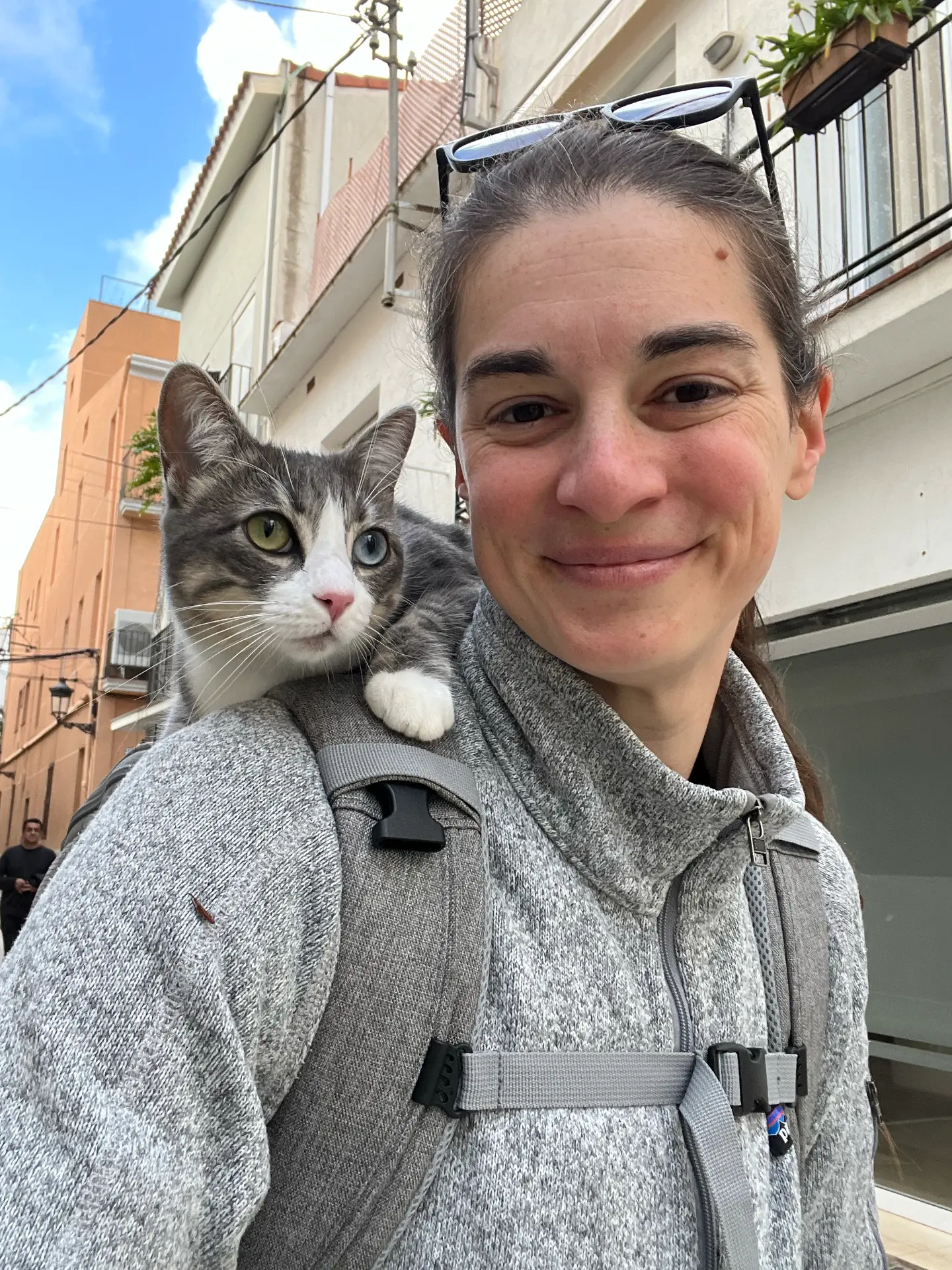 Melissa traveling with her cat Mila in a pet carrier.
